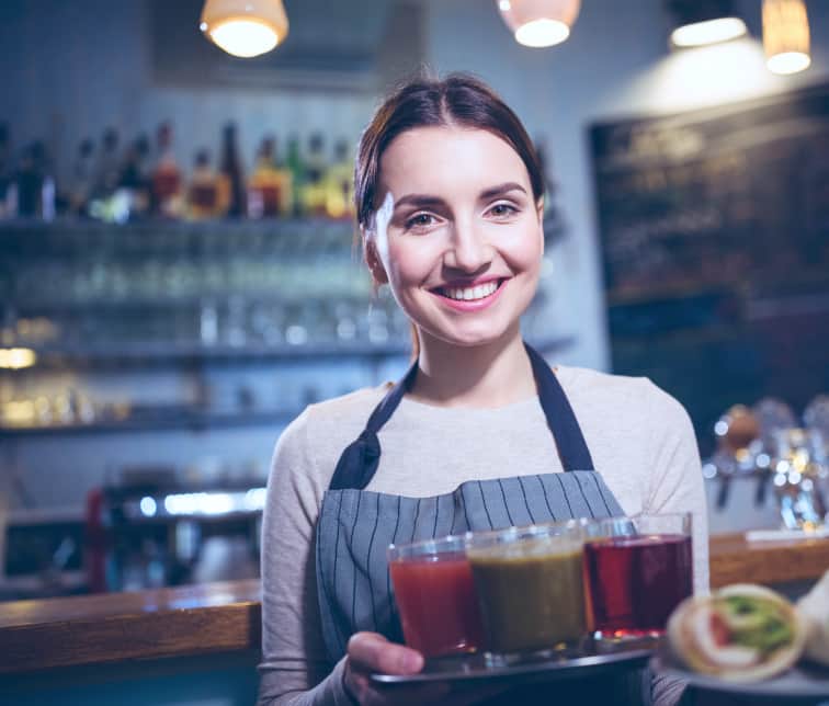 waitress holding plate of juices